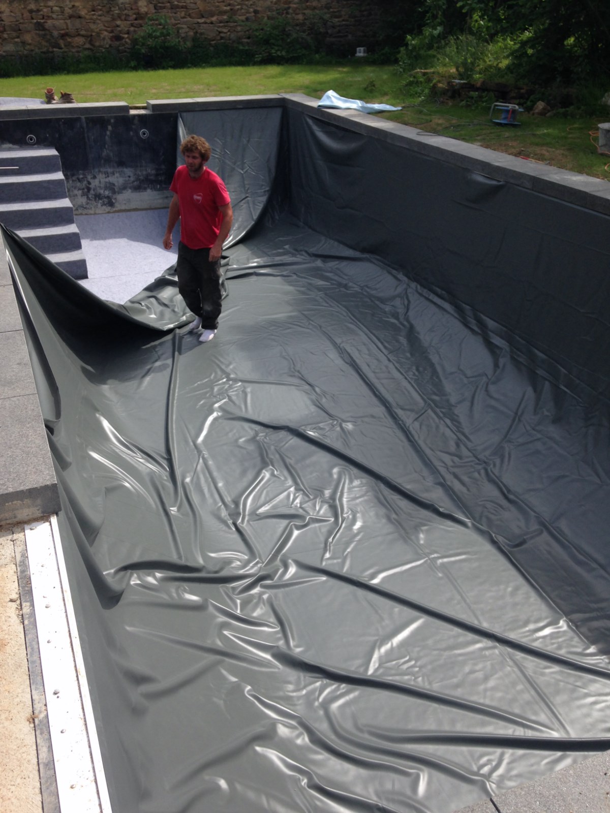 Mis en place du liner sur l'escalier